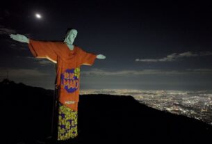 Símbolos da Campanha 18M iluminaram o Cristo Redentor na noite do sábado — Agência Gov